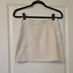 Athleta Cream Mini Skirt With Inner Hidden Pocket. Size XXS EUC